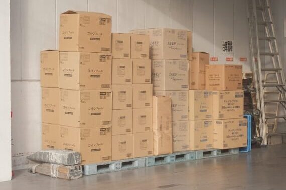brown cardboard boxes on white floor tiles